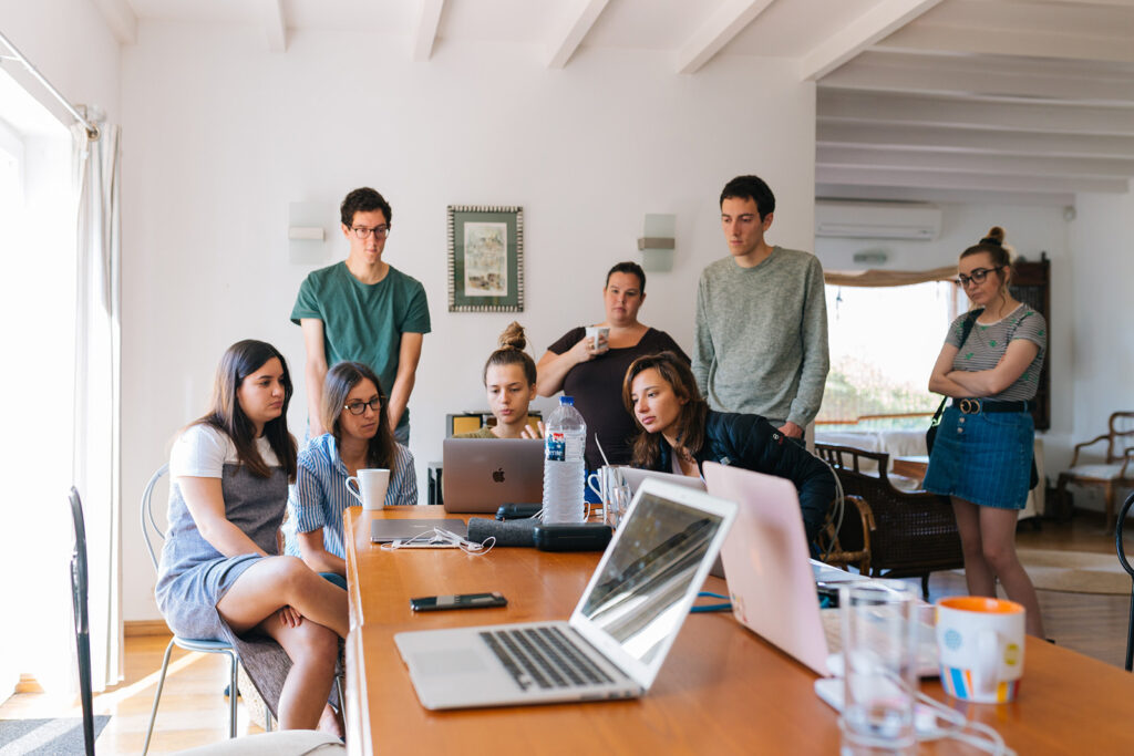 team meeting looking at a laptop