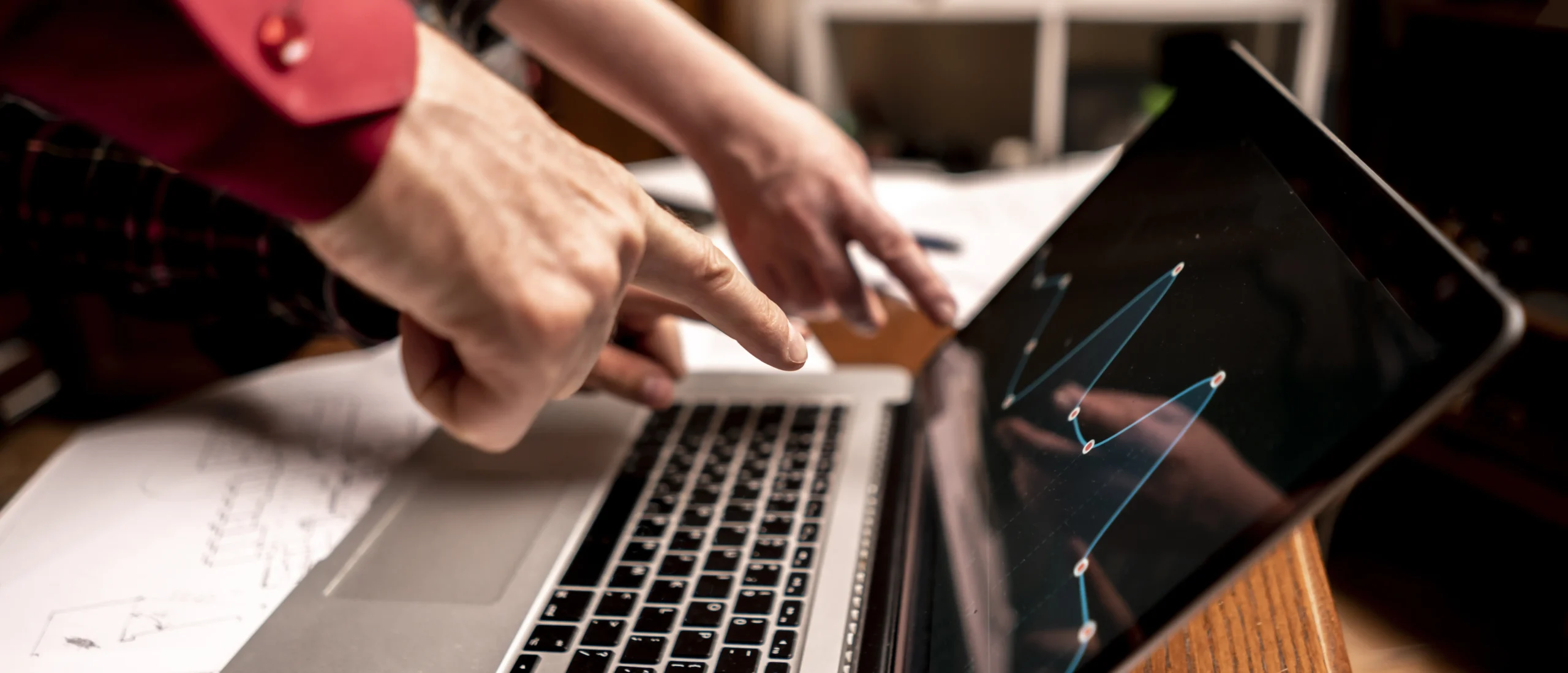 Hand pointing at keyboard in business | Cybersecurity for Small Business: Protecting Against Phishing, Ransomware, and Malware