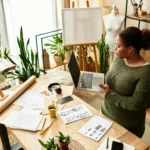 Small business owner shown happy and with peace of mind as her cybersecurity team protects her data.