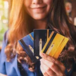 someone giving their credit cards away