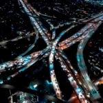 Aerial view of traffic a night, representing large amounts of website traffic